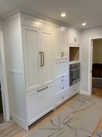 white and gold cabinets