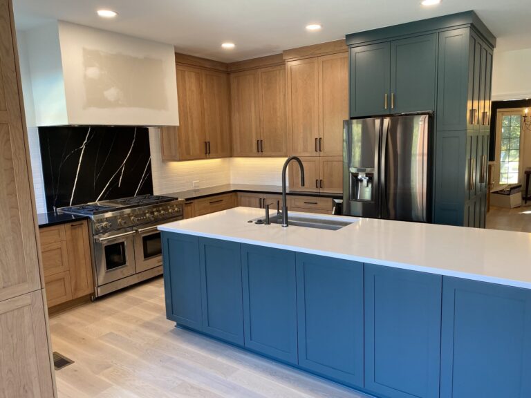 high end green and gold cabinet install with wooden cabinets